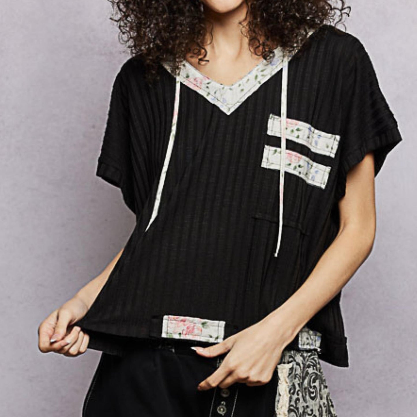 POL black short sleeve hooded top with front pocket — front view.