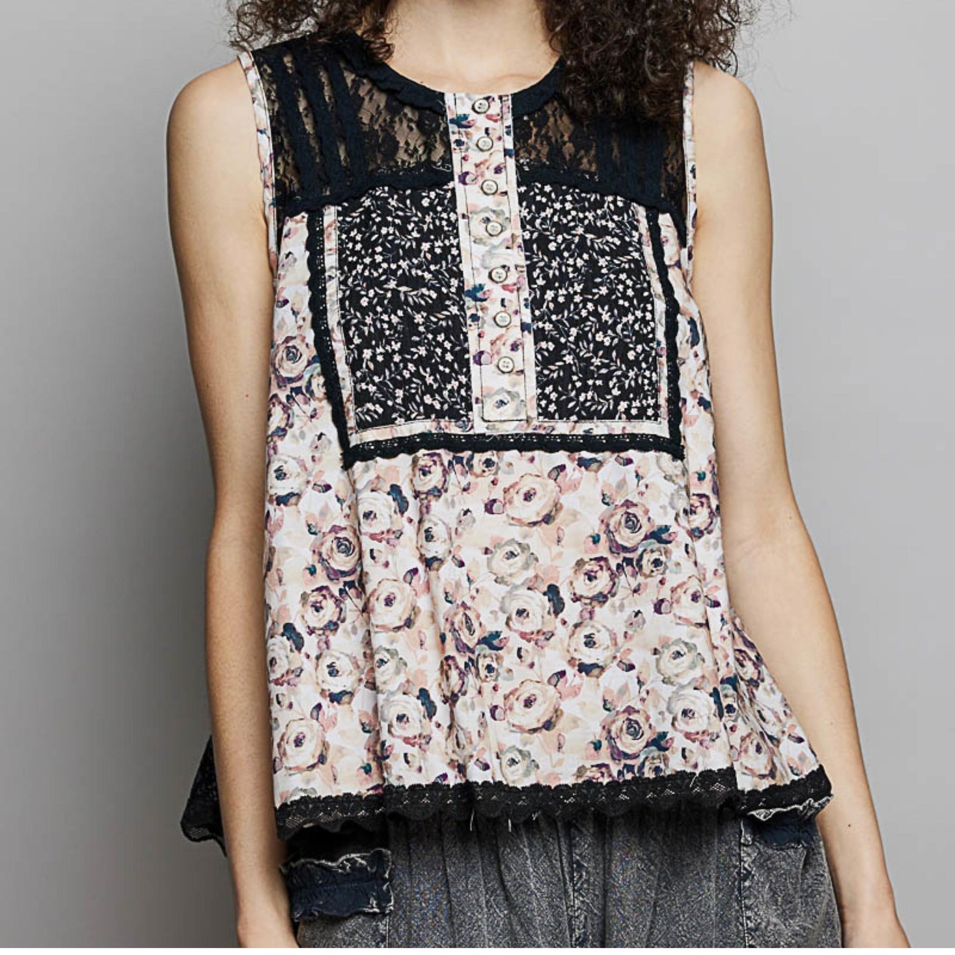 POL black printed sleeveless top with intricate lace back and button detail.