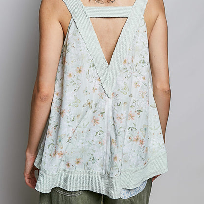 Back view of the POL floral tank showing the relaxed silhouette and curved hem.