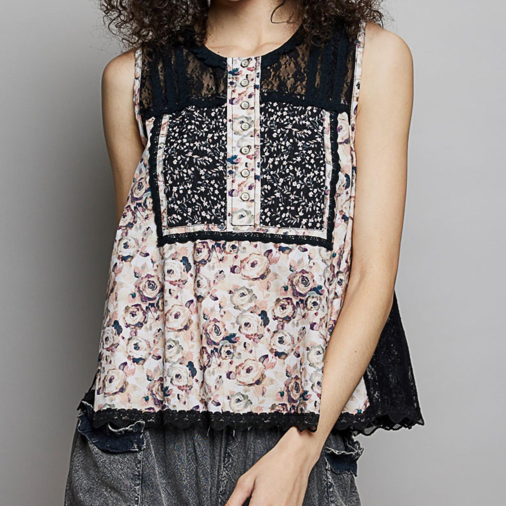 Frontal view of the POL printed cotton sleeveless blouse in black.