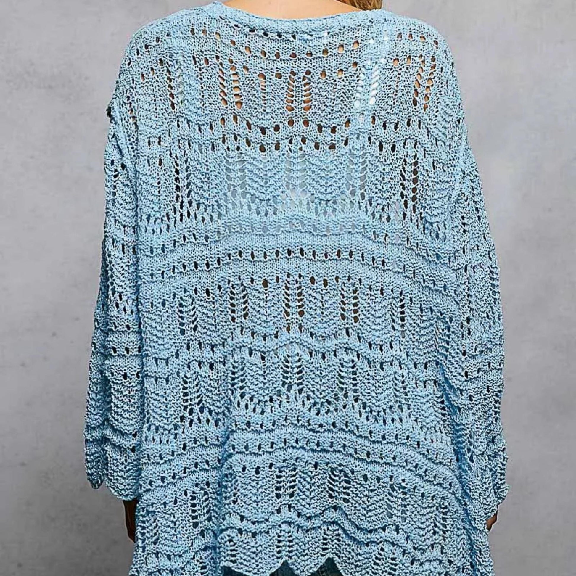 Back view of the POL sky blue cardigan showing the relaxed, oversized fit.