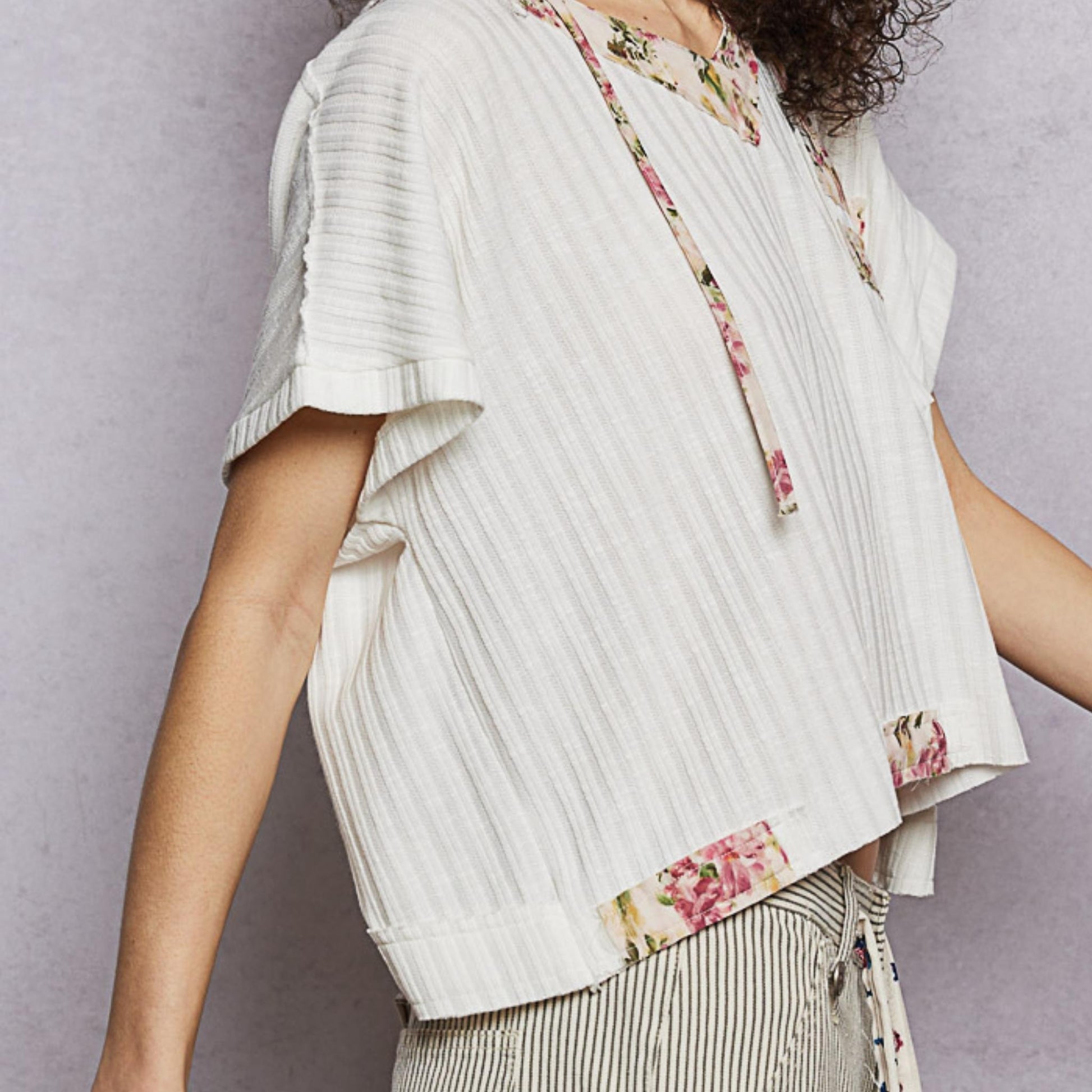POL off white short sleeve hooded top in a relaxed fit — side perspective.