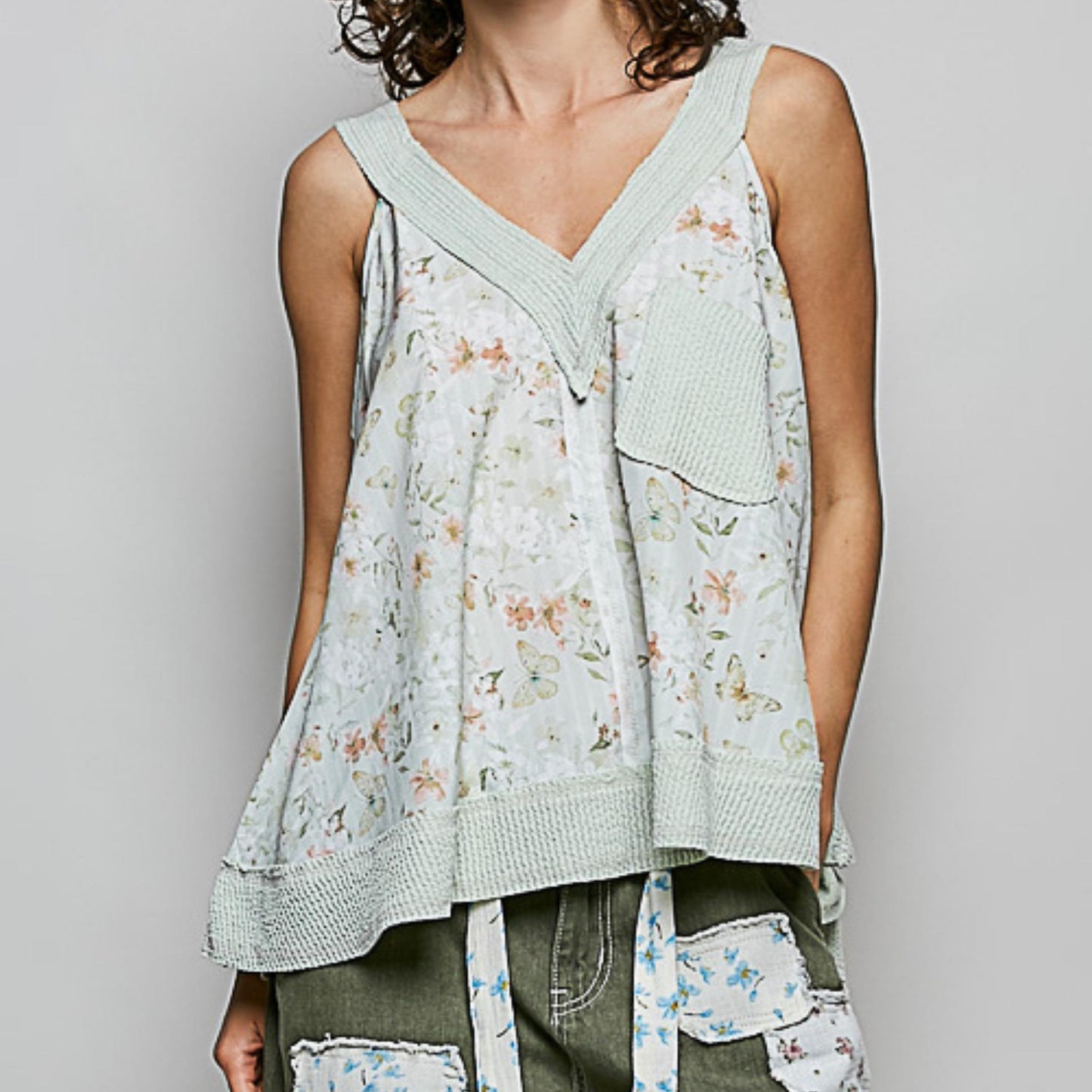 Frontal view of the POL sage floral print sleeveless top.