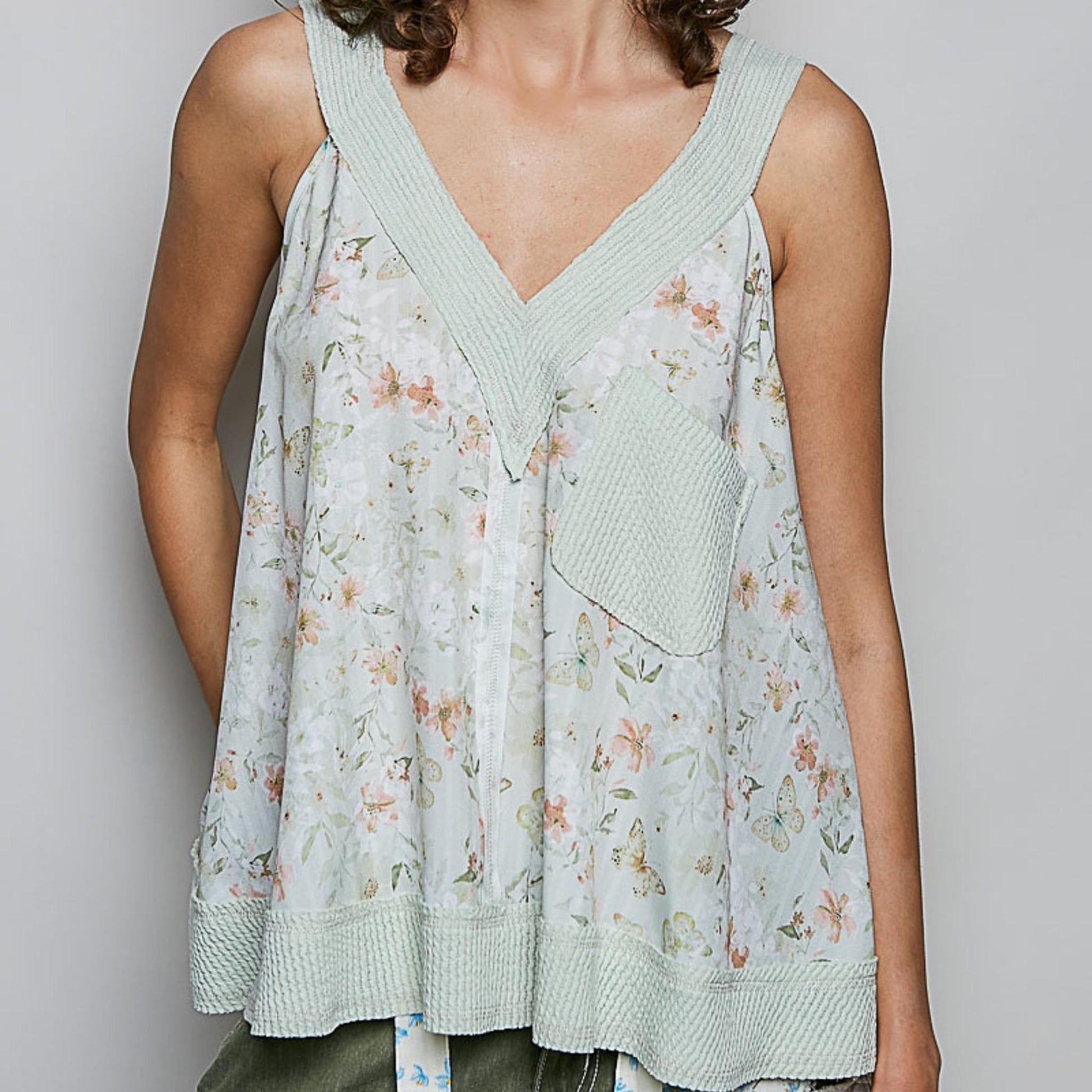 POL floral V-neck tank in sage multi with a functional front pocket.