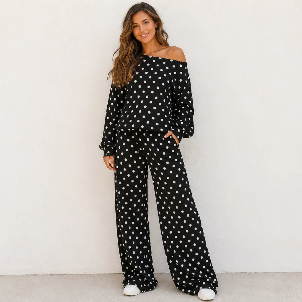 Woman wearing a black polka dot off-the-shoulder top and wide-leg pants set