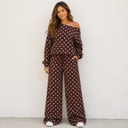 Woman wearing a coffee brown polka dot off-the-shoulder top and wide-leg pants set
