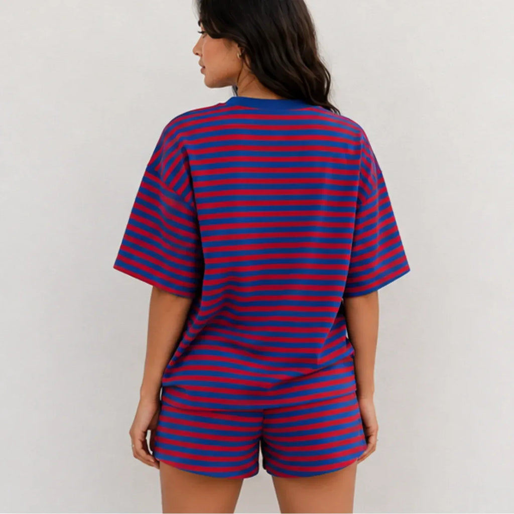 Back view of model wearing red and royal blue horizontal striped short-sleeve lounge set