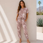 Women's red tie-dye short sleeve loungewear set with a relaxed-fit top, drawstring jogger pants, and side pockets for casual everyday comfort.