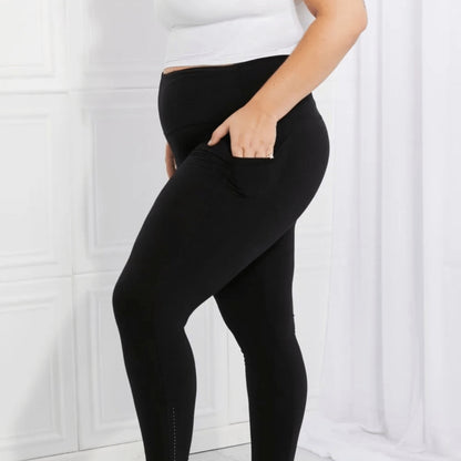 Detailed showcase of the opaque fabric and reflective dot design on performance leggings.
