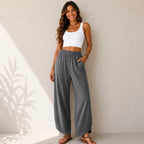 Women's relaxed wide leg cotton pants in charcoal gray with front patch pockets and relaxed silhouette.