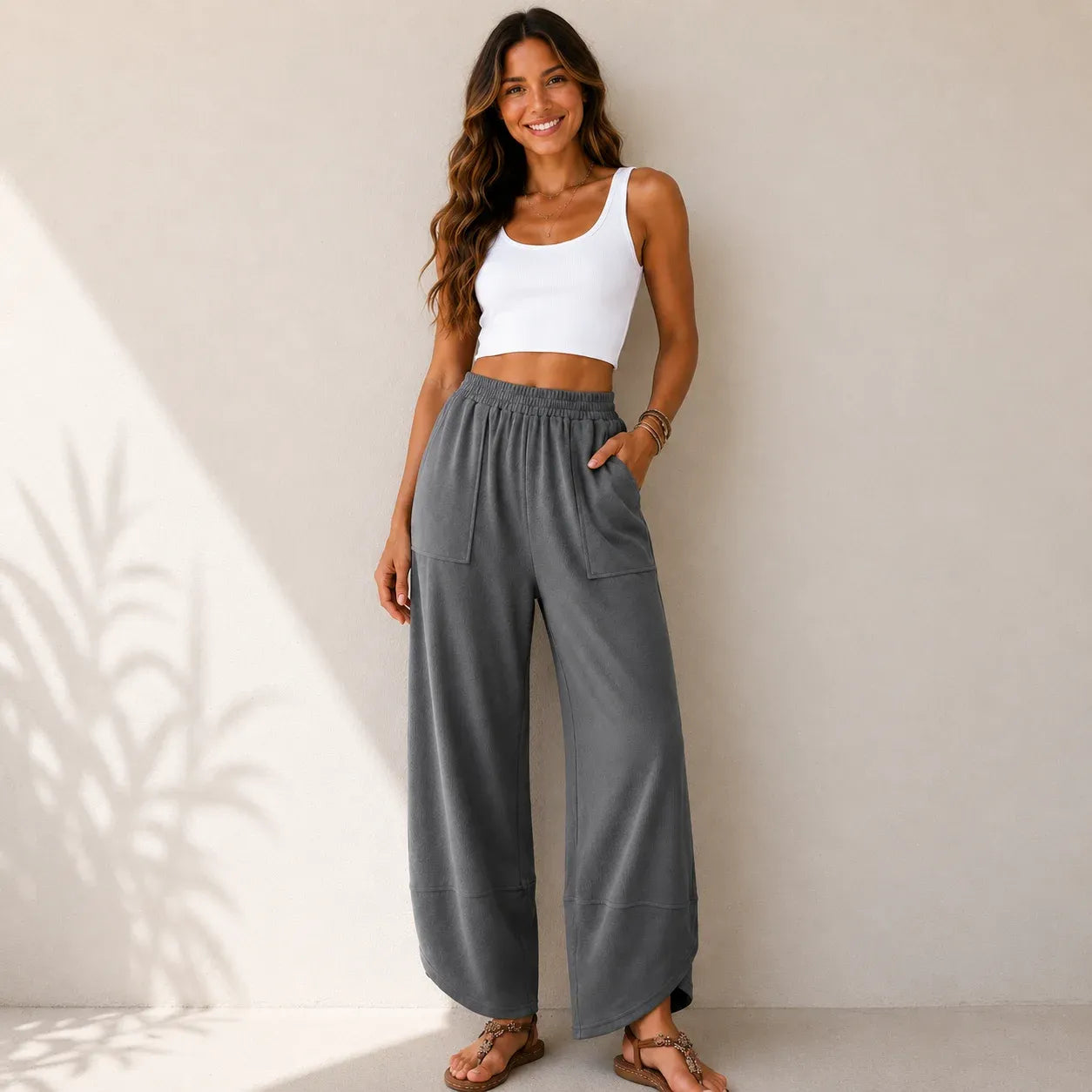 Women's relaxed wide leg cotton pants in charcoal gray with front patch pockets and relaxed silhouette.