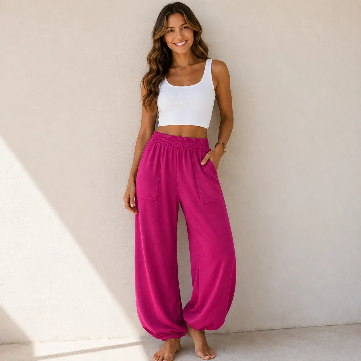 Women's relaxed wide leg cotton pants in hot pink with front patch pockets and relaxed fit.