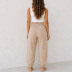 Back view of women's relaxed wide leg khaki cotton pants with a comfortable elastic waistband and relaxed fit.