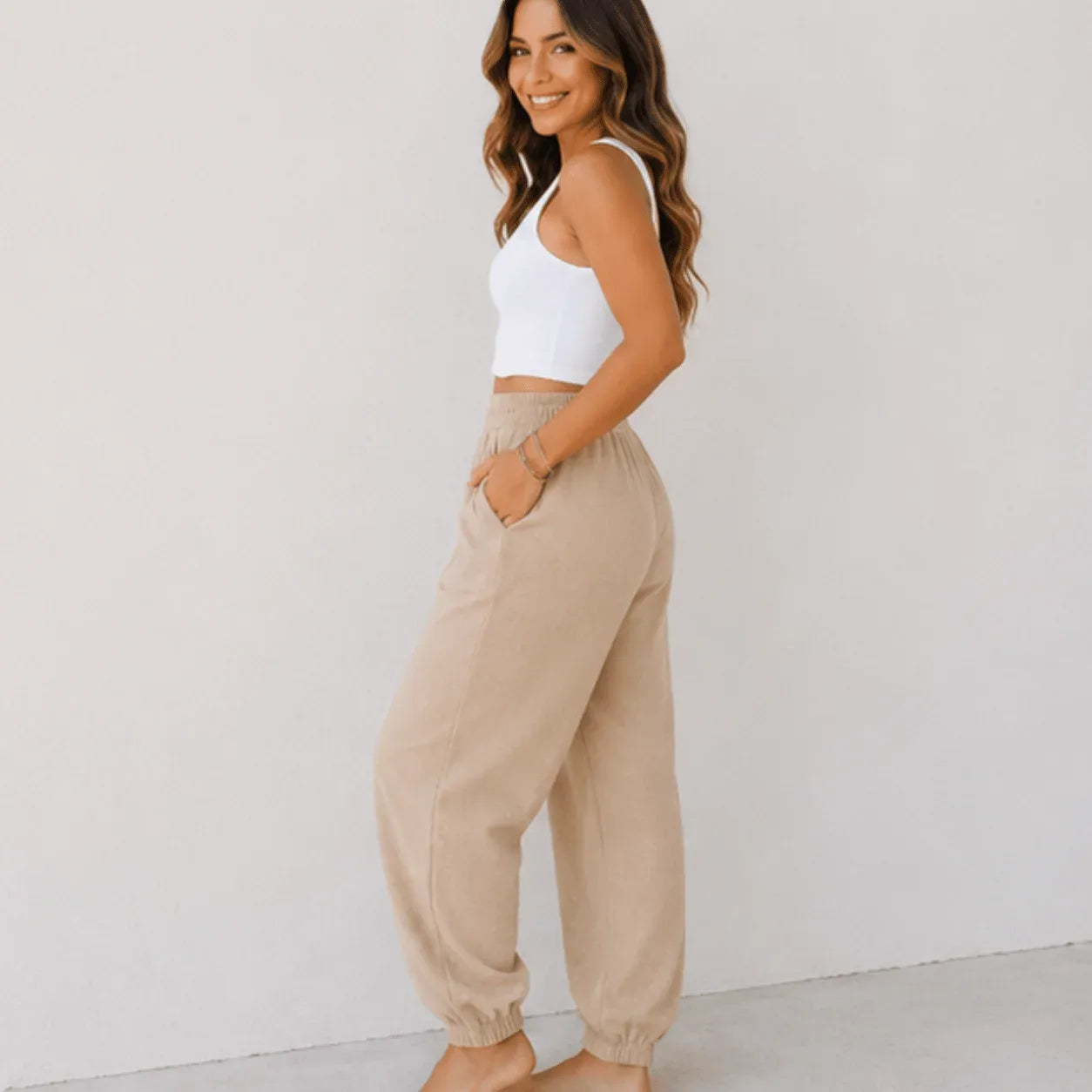 Side view of women's relaxed wide leg khaki cotton pants with elastic waist, oversized fit, and front patch pockets.