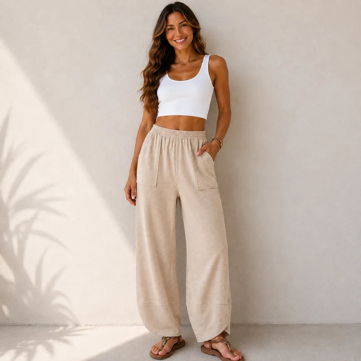 Women's relaxed wide leg cotton pants in off white featuring a comfortable loose fit and elastic waist.