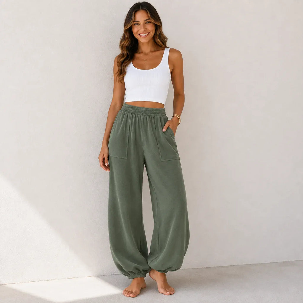 Women's relaxed wide leg cotton pants in sage green with a loose fit and front patch pockets.