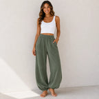 Women's relaxed wide leg cotton pants in sage green with a loose fit and front patch pockets.