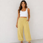 Women's relaxed wide leg cotton pants in yellow with a relaxed silhouette and oversized patch pockets.