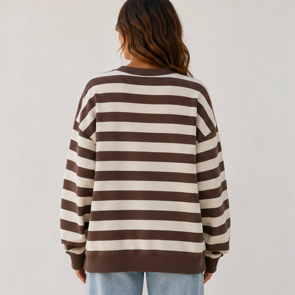 Back view of the women's retro striped crew neck sweatshirt in coffee stripes with a loose fit, soft sweatshirt fabric, and ribbed hem and cuffs.