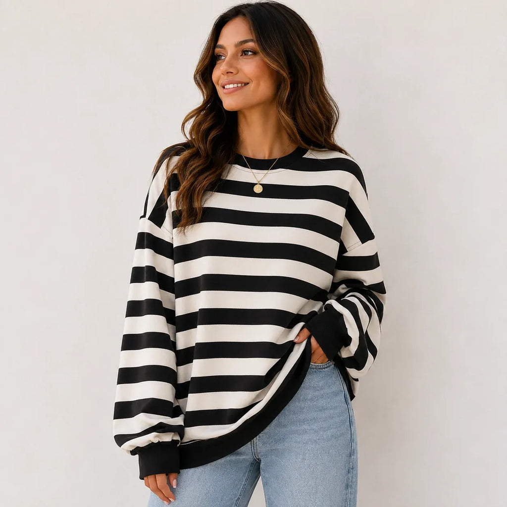 Women's retro striped crew neck sweatshirt in black stripes featuring a relaxed oversized fit, soft brushed sweatshirt knit, long sleeves, and ribbed cuffs.