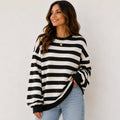 Women's retro striped crew neck sweatshirt in black stripes featuring a relaxed oversized fit, soft brushed sweatshirt knit, long sleeves, and ribbed cuffs.