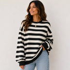 Women's retro striped crew neck sweatshirt in black stripes featuring a relaxed oversized fit, soft brushed sweatshirt knit, long sleeves, and ribbed cuffs.