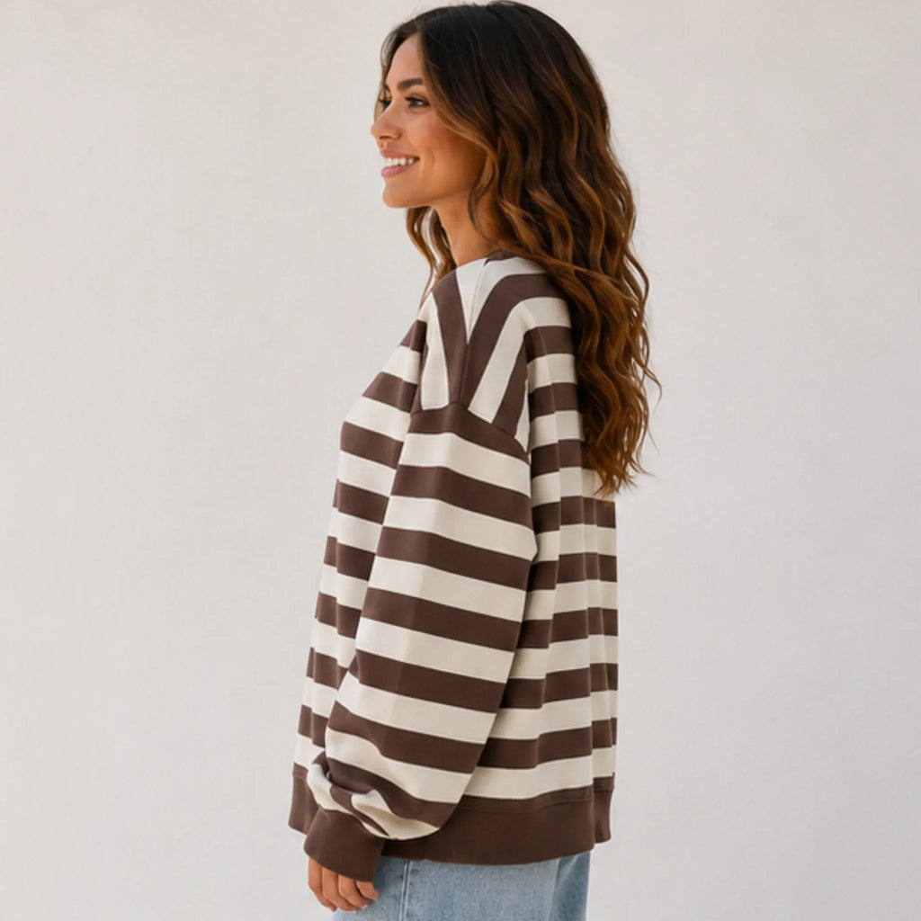 Side view of the women's retro striped crew neck sweatshirt in coffee stripes featuring a loose casual fit, dropped shoulders, and ribbed trim.