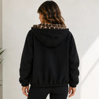 Reversible leopard hooded jacket in black, back view with leopard print hood lining