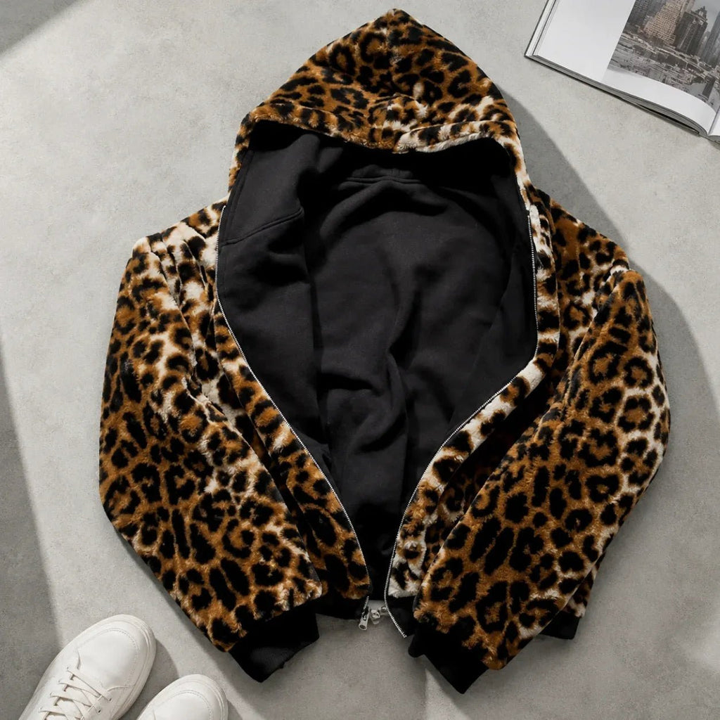 Reversible leopard hooded jacket displayed flat showing leopard print exterior and black interior