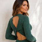 Close-up of green ribbed sweater dress open back and twisted bow detail