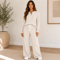 Women's Ribbed Henley Lounge Set in apricot featuring a soft ribbed Henley top with matching wide-leg drawstring pants.