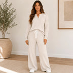 Women's Ribbed Henley Lounge Set in apricot featuring a soft ribbed Henley top with matching wide-leg drawstring pants.