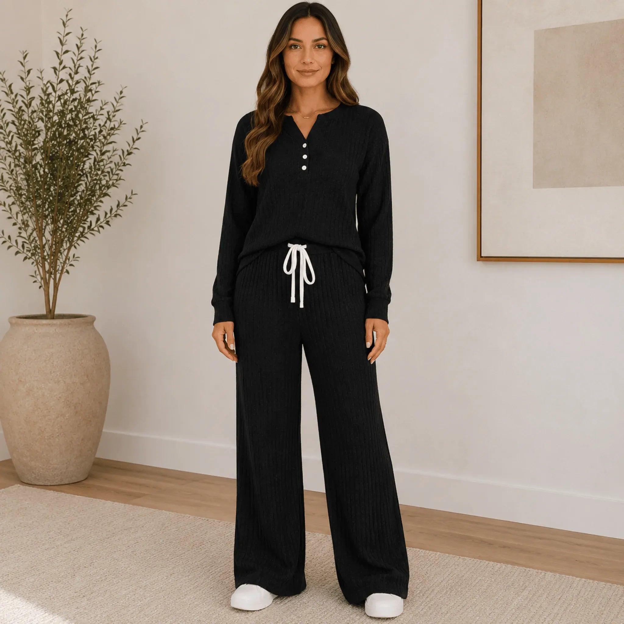 Black Ribbed Henley Lounge Set with long sleeve Henley top, chest pocket, ribbed knit fabric, and matching wide-leg lounge pants.