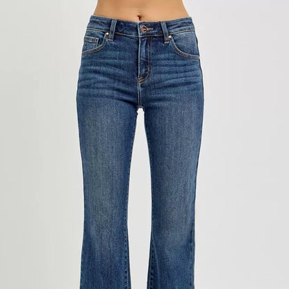 Close-up of the trendy frayed raw hem on RISEN dark wash denim.
