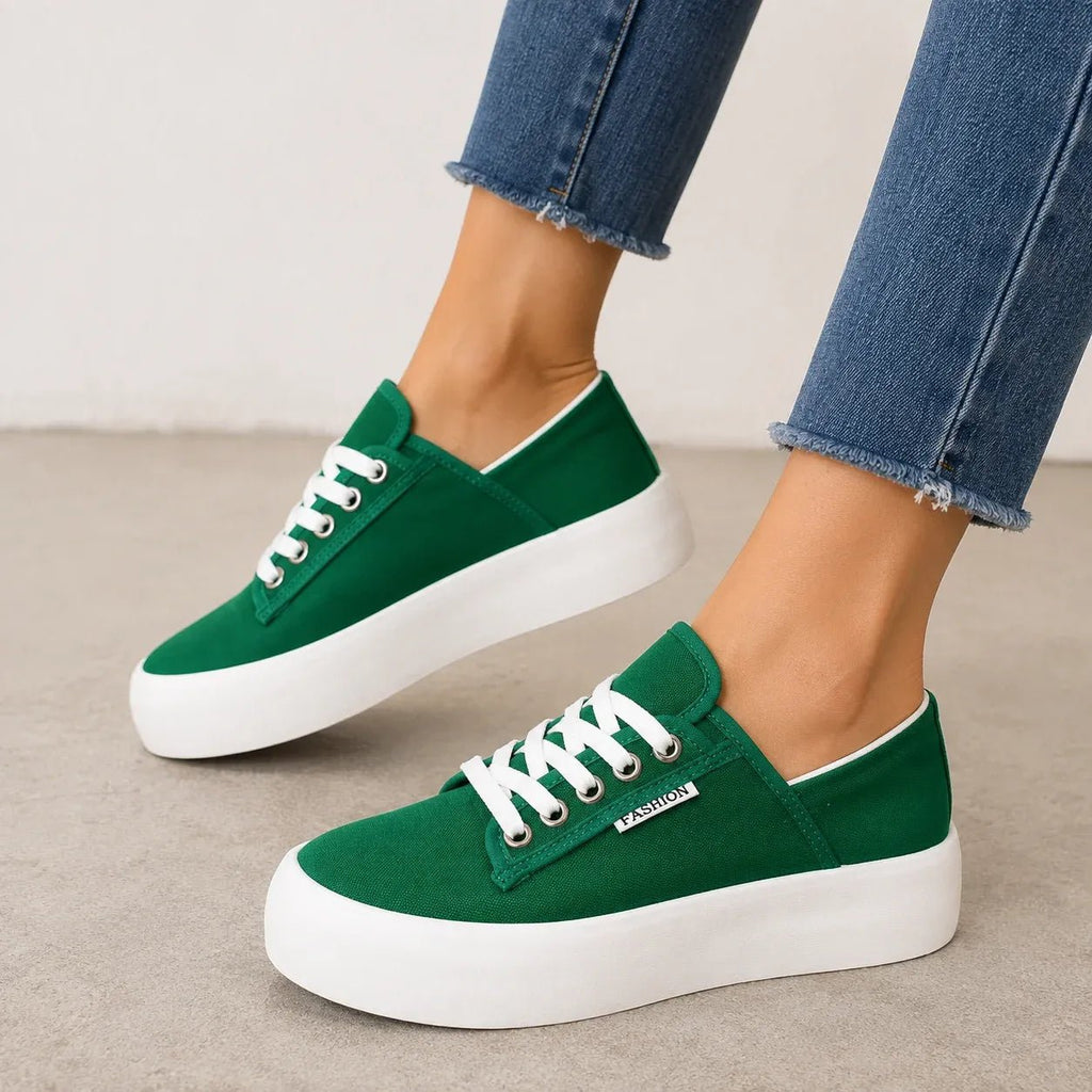 Green Roam Wild Convertible Sneakers with a low-top lace-up design and thick white platform sole.