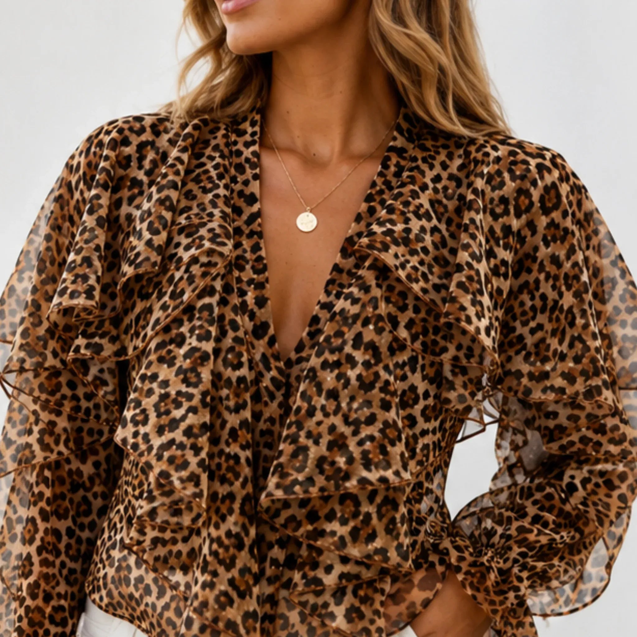 Close-up of the women's leopard print ruffle chiffon blouse highlighting cascading ruffles, V-neckline, and lightweight sheer chiffon fabric.