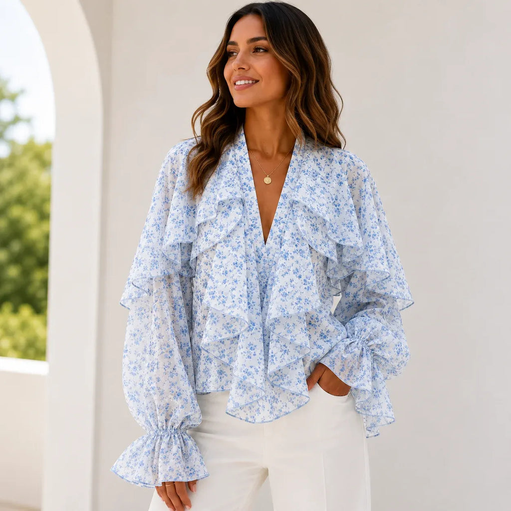 Women's blue floral ruffle chiffon long sleeve blouse featuring cascading layered ruffles, sheer sleeves, lightweight chiffon fabric, and a feminine V-neckline.
