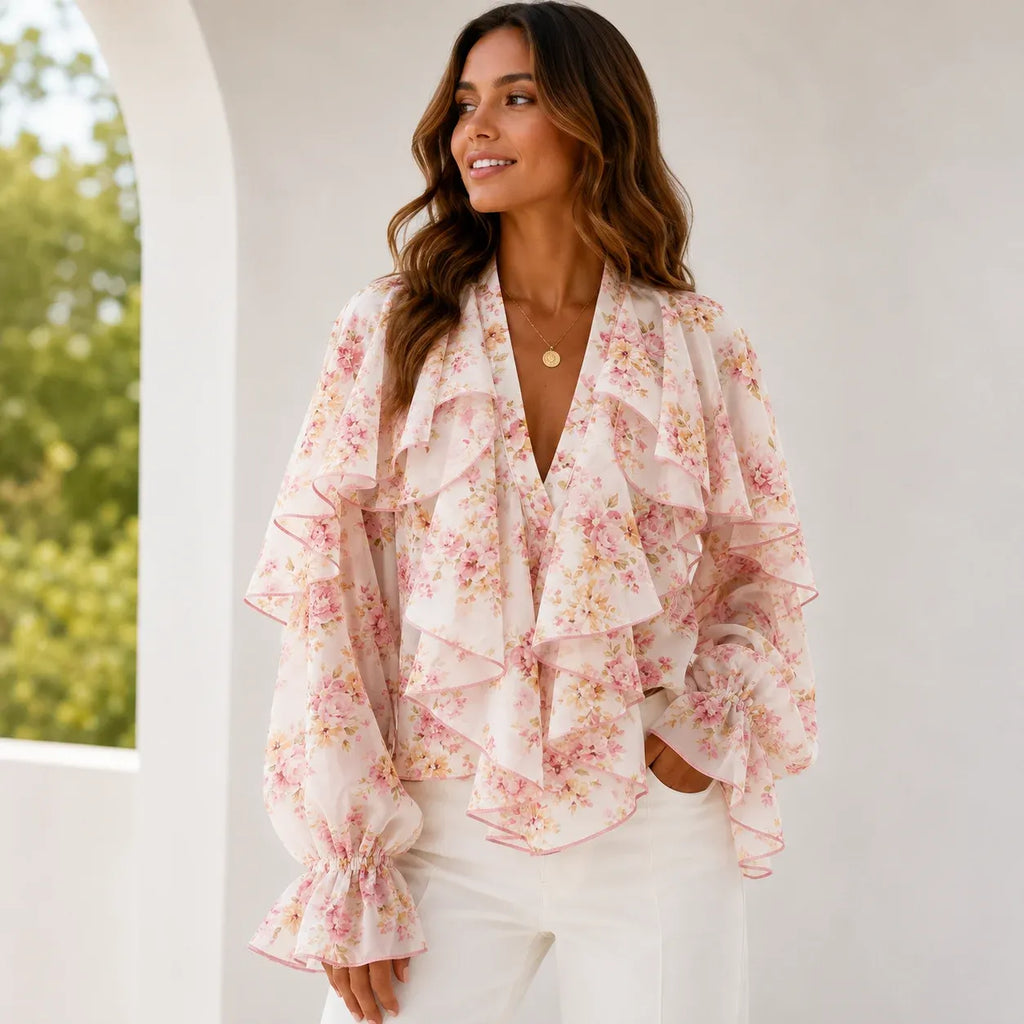 Women's pink floral ruffle chiffon long sleeve blouse featuring cascading front ruffles, sheer sleeves, soft floral print, and a romantic silhouette.