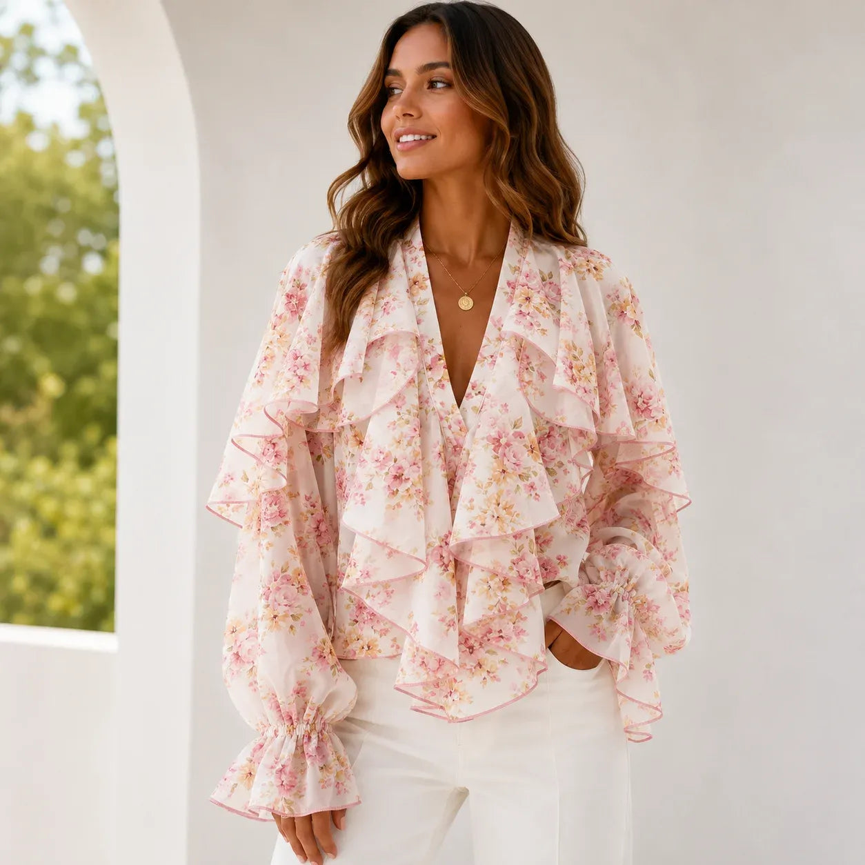 Women's pink floral ruffle chiffon long sleeve blouse featuring cascading front ruffles, sheer sleeves, soft floral print, and a romantic silhouette.