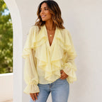 Women's pastel yellow ruffle chiffon long sleeve blouse featuring cascading front ruffles, sheer balloon sleeves, and a feminine flowy silhouette.