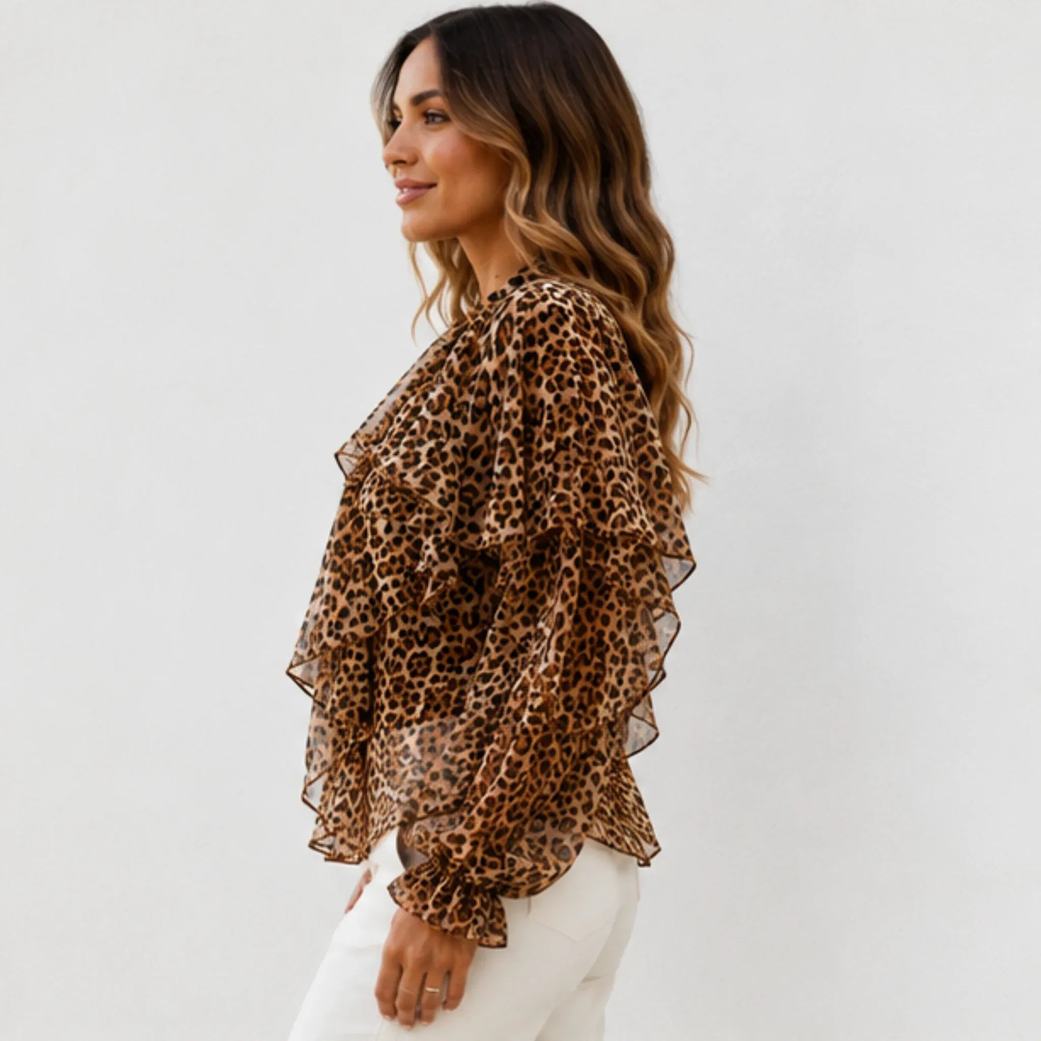 Side view of the women's leopard print ruffle chiffon blouse showcasing cascading layered ruffles, sheer balloon sleeves, and a relaxed fit.