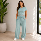 Sage green fitted top and wide-leg pants set for women