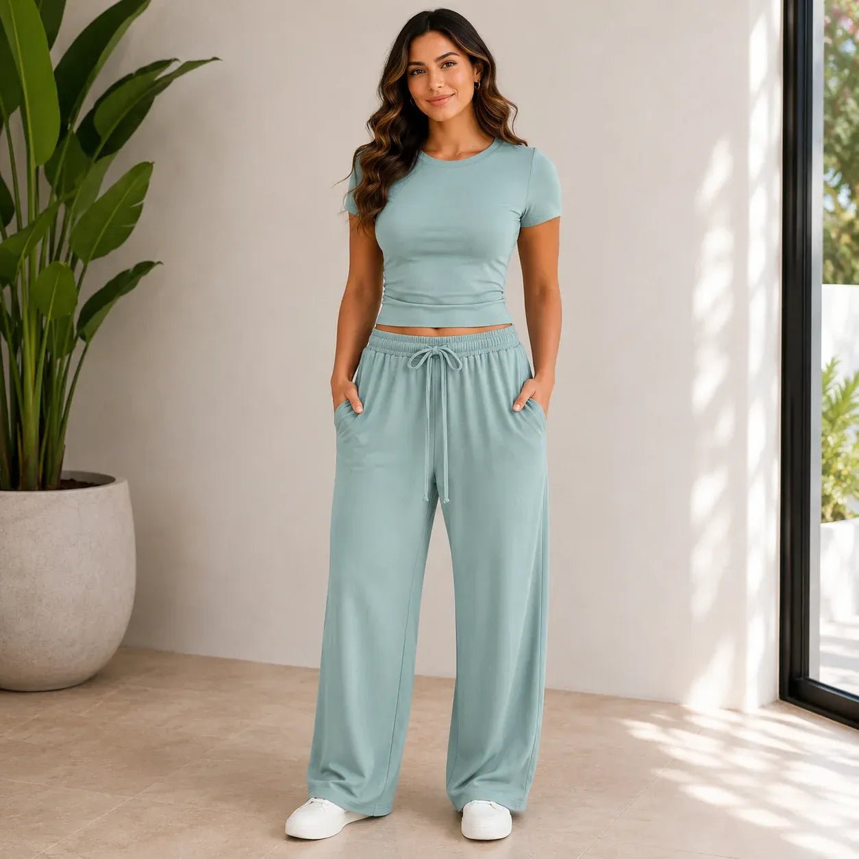 Sage green fitted top and wide-leg pants set for women