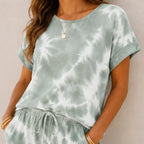 Close-up of the sage green tie-dye short sleeve top and drawstring jogger pants showing the soft fabric and pattern.