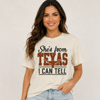 Woman wearing She's From Texas I Can Tell country graphic T-shirt with longhorn design at Solazura Boutique