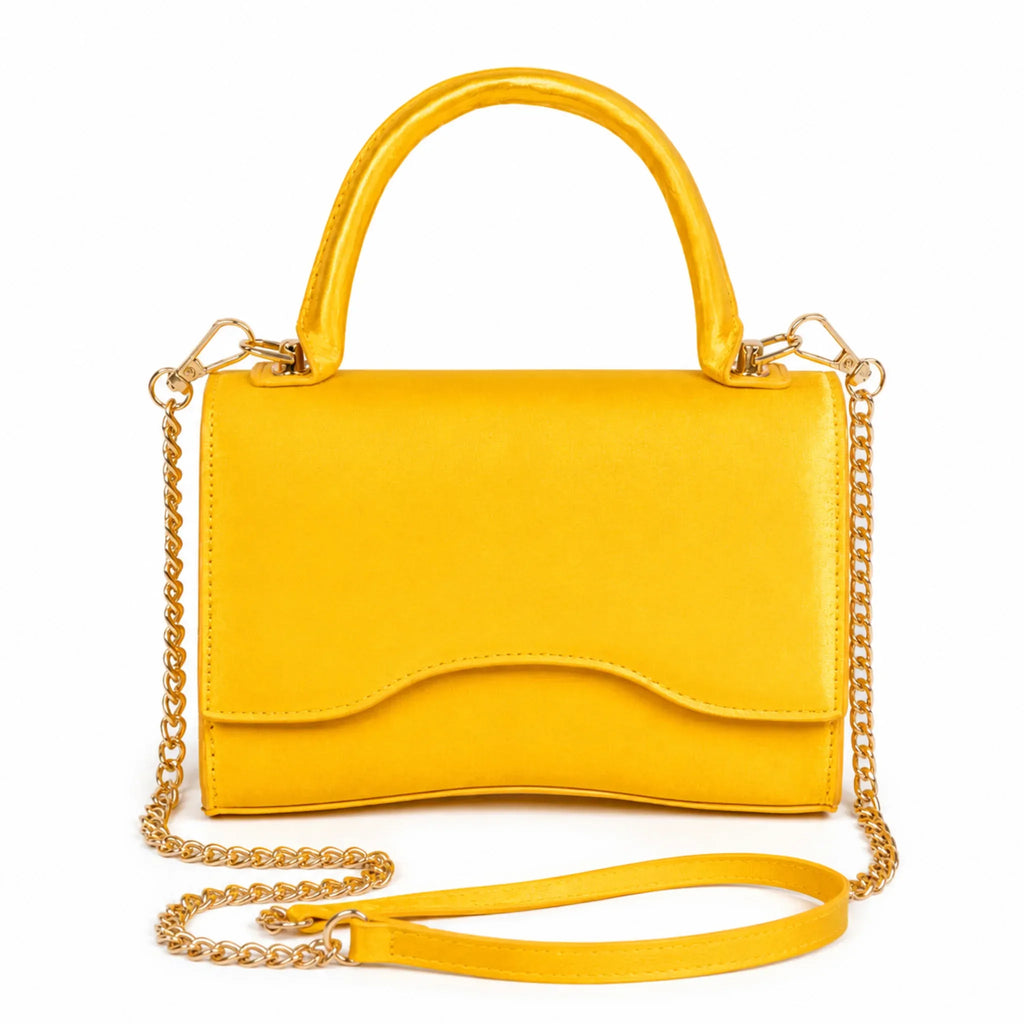 Mustard Shiny Chain Crossbody Bag with gold chain strap and top handle from Solazura Boutique.