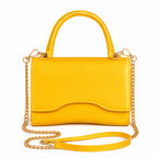 Mustard Shiny Chain Crossbody Bag with gold chain strap and top handle from Solazura Boutique.