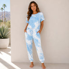 Women's sky blue tie-dye two-piece loungewear set with short sleeve top, drawstring waist, and jogger pants.
