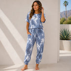 Women's slate blue tie-dye loungewear set with relaxed top and drawstring jogger pants.