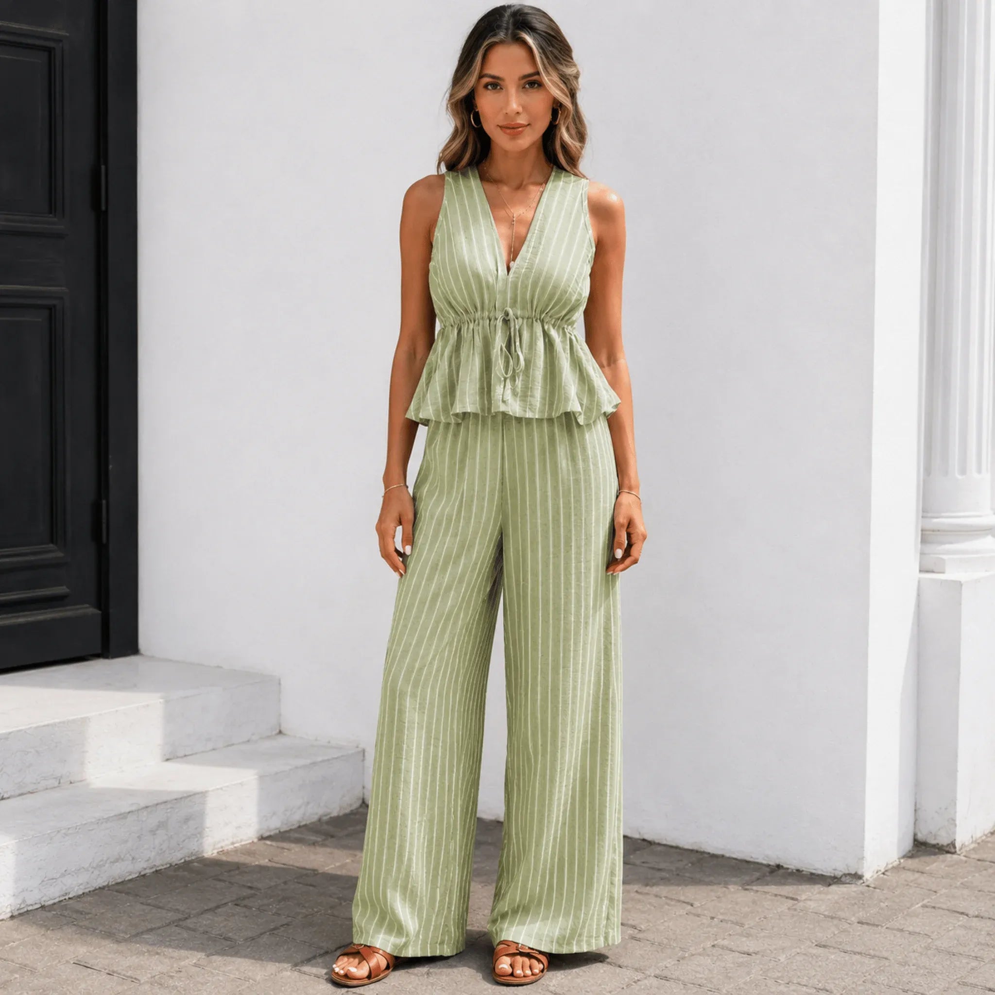 Women's sleeveless striped wide-leg pants two-piece set in aqua green with a lightweight peplum top and flowy pants.